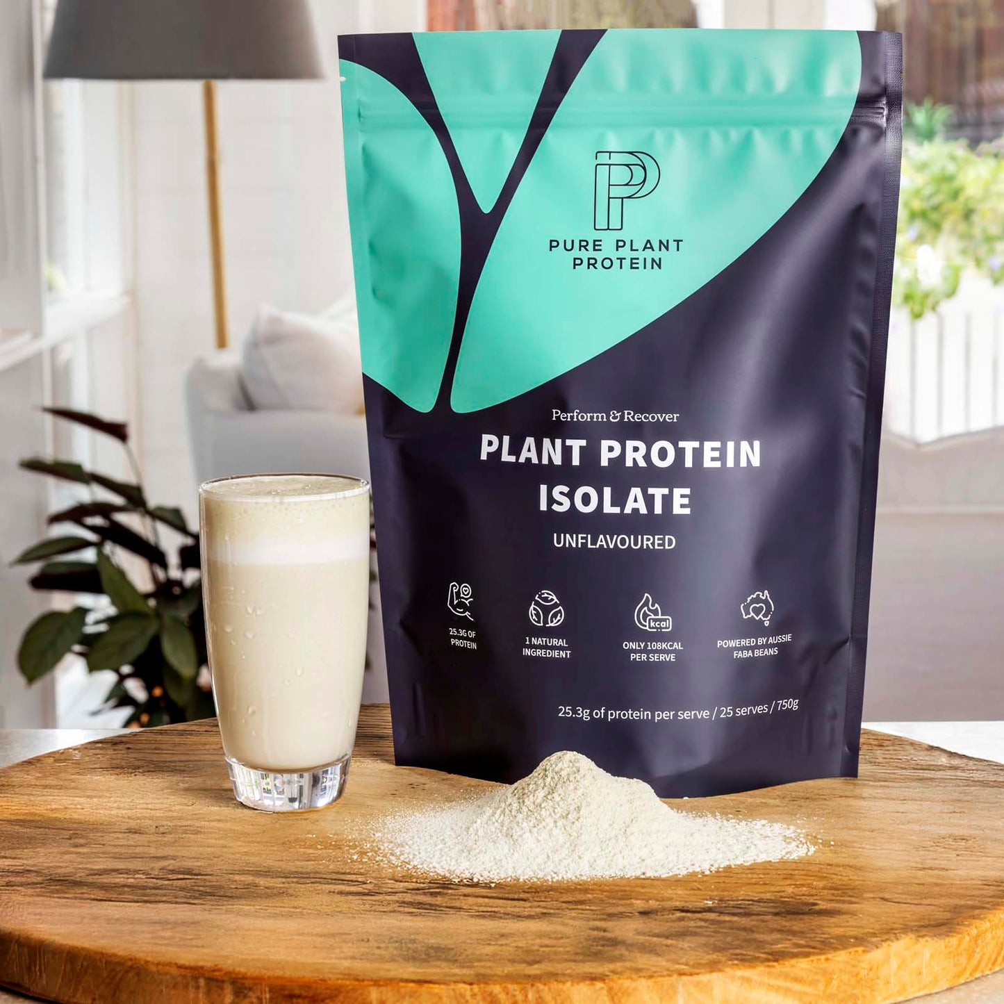 Pure Plant Protein plant protein isolate package with a glass of protein shake on a wooden surface.